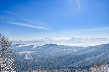 Winter cold mountain landscape with blue sky