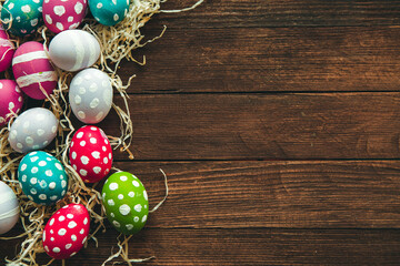 Hand painted pastel colored Easter eggs background. Happy Easter greeting card or invitation.