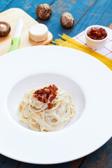 Spaghetti bacon cheese sauce with ingredient homemade on the wooden table.