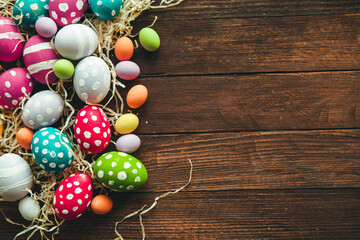 Hand painted pastel colored Easter eggs background. Happy Easter greeting card or invitation.