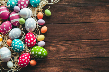 Hand painted pastel colored Easter eggs background. Happy Easter greeting card or invitation.