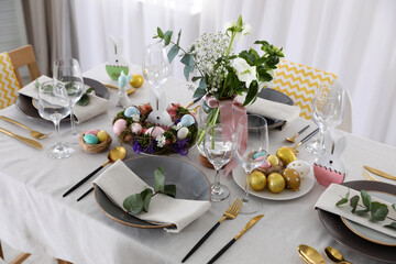 Beautiful Easter table setting with festive decor indoors