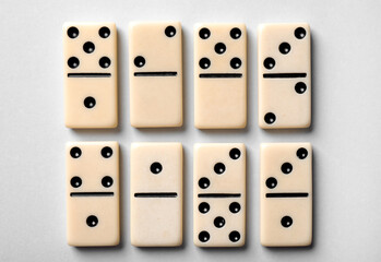 Set of classic domino tiles on white background, top view
