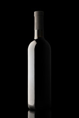 illuminated silhouette of a bottle with wine on a black background