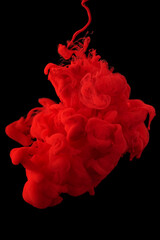 acrylic ink in water form an abstract smoke pattern isolated on black background - obrazy, fototapety, plakaty