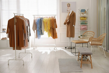 Stylish women's clothes and accessories in modern boutique