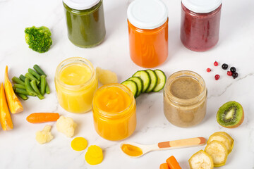 Variety of homemade baby vegetable and fruit puree