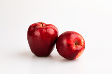An apple fruit with full and a half showing in isolated background.
