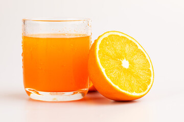 An orange in fruit with full and a half showing in isolated background.