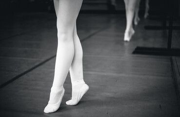 ballerinas feet in pointe on the floor close-up