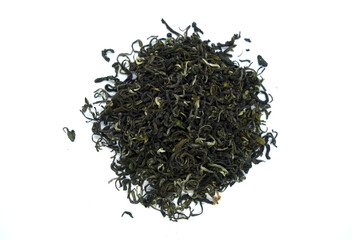 Dry green tea isolated on white with blur effect.