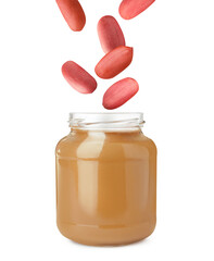 Delicious peanut butter in glass jar on white background