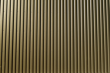 Ridged metal wall background in brown color