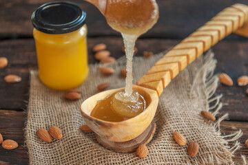 honey in a wooden spoon on the table