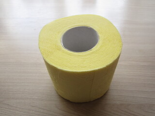a roll of yellow tissue paper