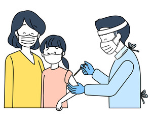 予防接種を受ける子どもとその親（マスクとフェイスシールド）