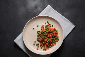 Boiled carrots and peas. Healthy food