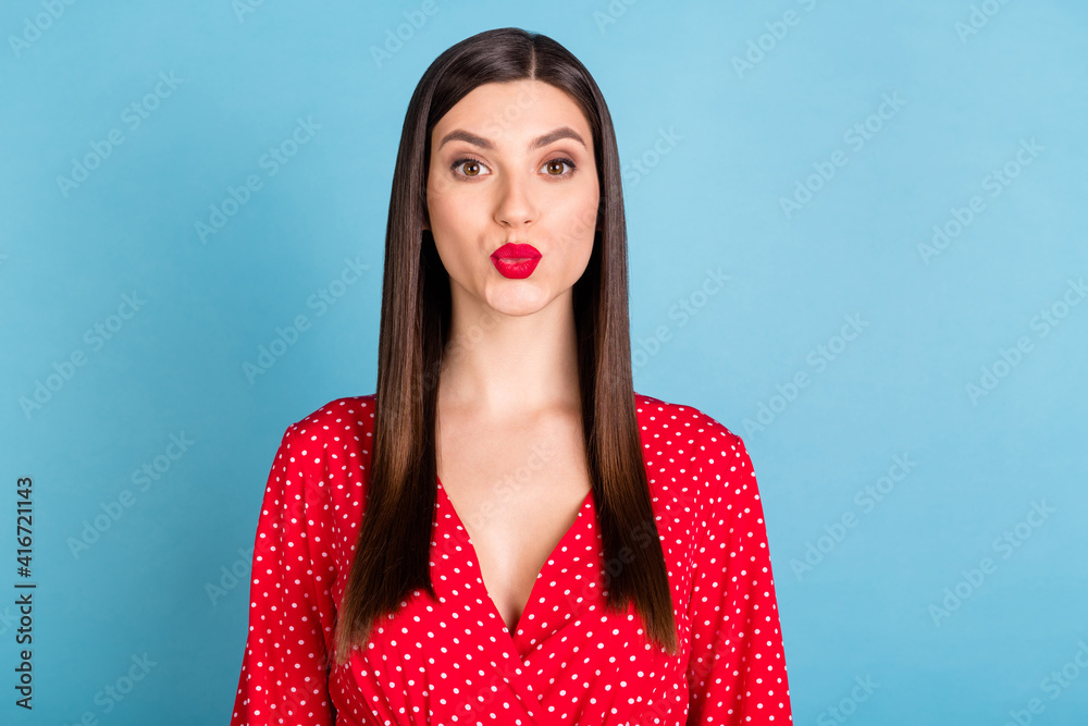 Wall mural Portrait of attractive gorgeous girl sending air kiss flirt isolated over vibrant blue color background