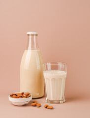 Plant based almond milk in bottle and glass