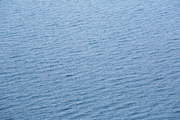 Blue tropical sea surface with waves and ripples