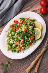 Tabbouleh or Tabouleh salad with bulgur, eastern appetizer 