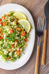 Tabbouleh or Tabouleh salad with bulgur, eastern appetizer 
