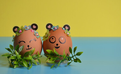 Two Easter eggs close-up on a yellow-blue background. Easter.