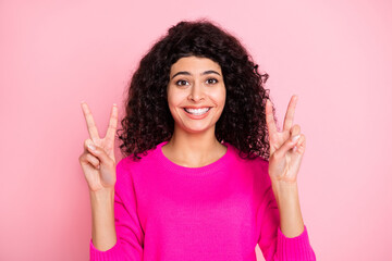 Portrait of young lovely pretty cheerful happy smiling girl showing okay sign isolated on pink color background