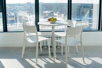 beautiful kitchen in the office with large panoramic windows and city views