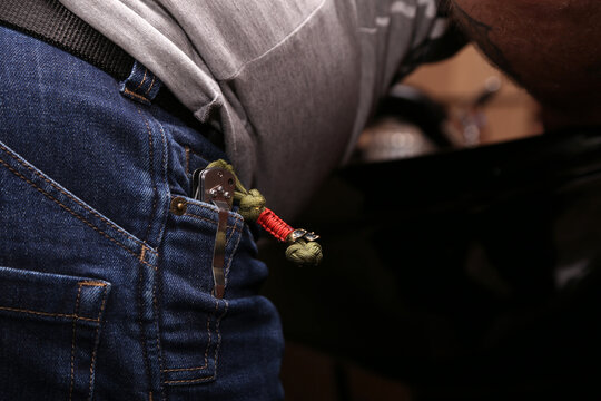 folding knife in jeans pocket
