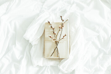 Spring is coming. Reading concept with vintage books on white background with pussy willow twig. Flat lay. Cozy home still life