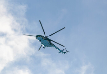 Fototapeta na wymiar Helicopter in the winter sky