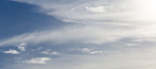 blue sky with white clouds and sun light. Nature background of sky	