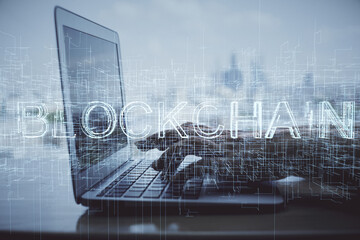 Double exposure of woman hands typing on computer and crypto market theme hologram drawing....