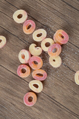 Pink circle jellybeans on the wooden table