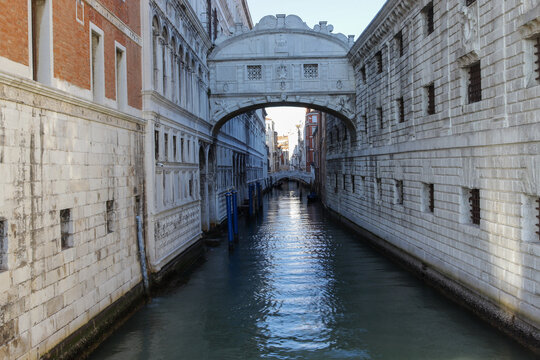 Canal With Clear Water In Venice On A Street In Italy In Warm Spring