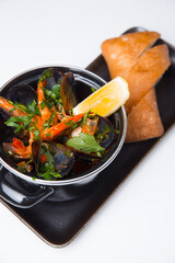 Photo of tasty delicious fresh mussels boiled in a pan, sea food.