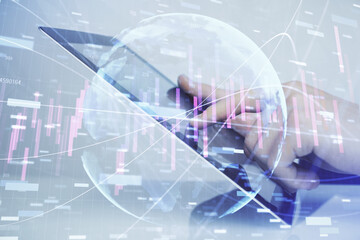 Multi exposure of man's hands holding and using a digital phone and forex graph drawing. Financial market concept.