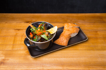 Photo of tasty delicious fresh mussels boiled in a pan, sea food.