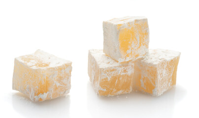 lucum cubes in powdered sugar isolated on white