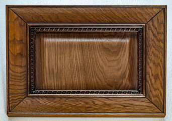 kitchen facade made of solid oak covered with brown lacquer. wood background