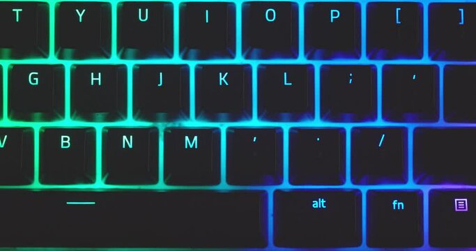 Closeup of illuminated mechanical keyboard keys in motion