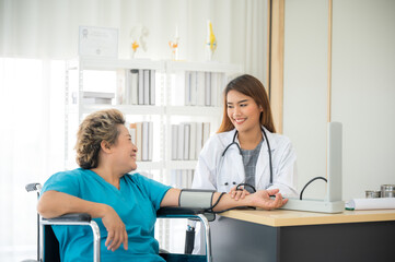 young woman doctor examining female patient person in hospital, health care concept