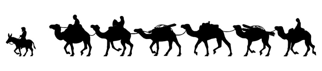 Silhouette of a camel caravan in the desert.