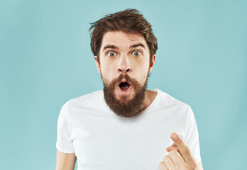 Cropped view of man in white t-shirt on blue background portrait model