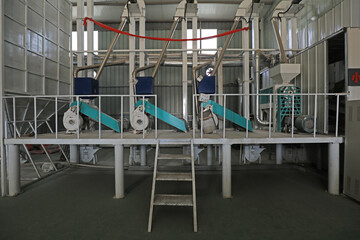 Advanced rice processing equipment in a grain processing plant, North China