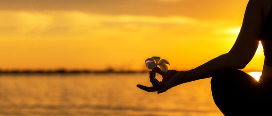 Close up Silhouette hands. Woman do yoga outdoor. Woman exercising vital and meditation for fitness...