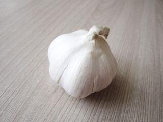 Fresh head of garlic on table surface