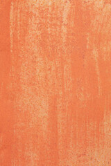 Old texture of rusty sheet metal with peeling orange paint.	