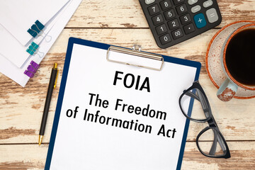 Paper with The Freedom Of Information Act FOIA on a table